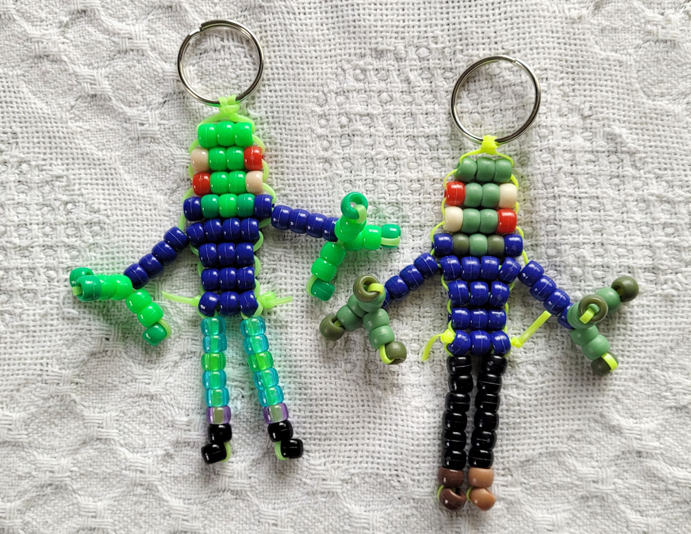 Two pony-bead keychains of Salad Fingers, a green humanoid