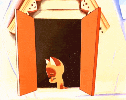 An animated gif of a siamese kitten licking his paw