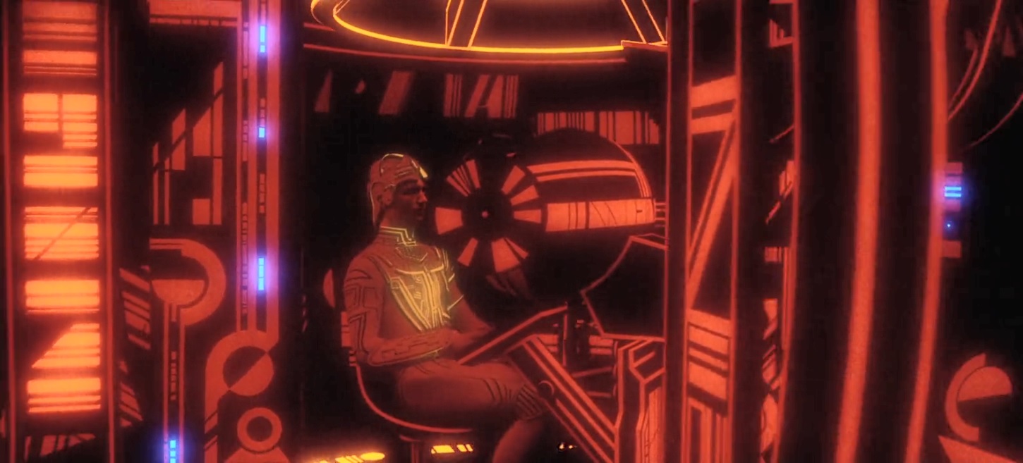 Clu sitting in the dark red cockpit of his tank.