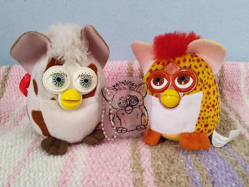 Two plush Furby keychains and one small flat keychain